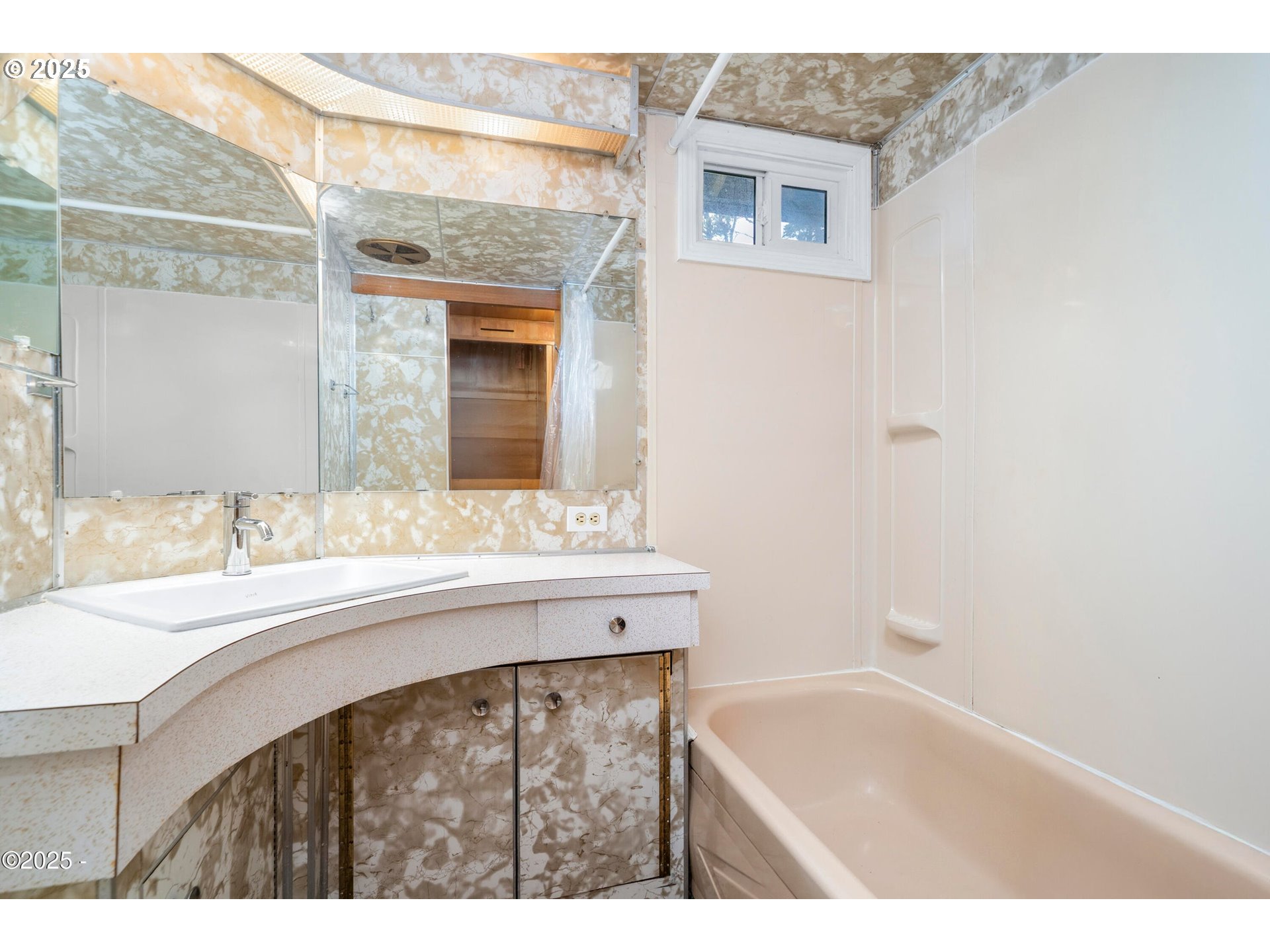 4875 Highway 101, Unit 11 Depoe Bay, OR 97341 - Photo 12 of 32 a bathroom with a sink and a mirror