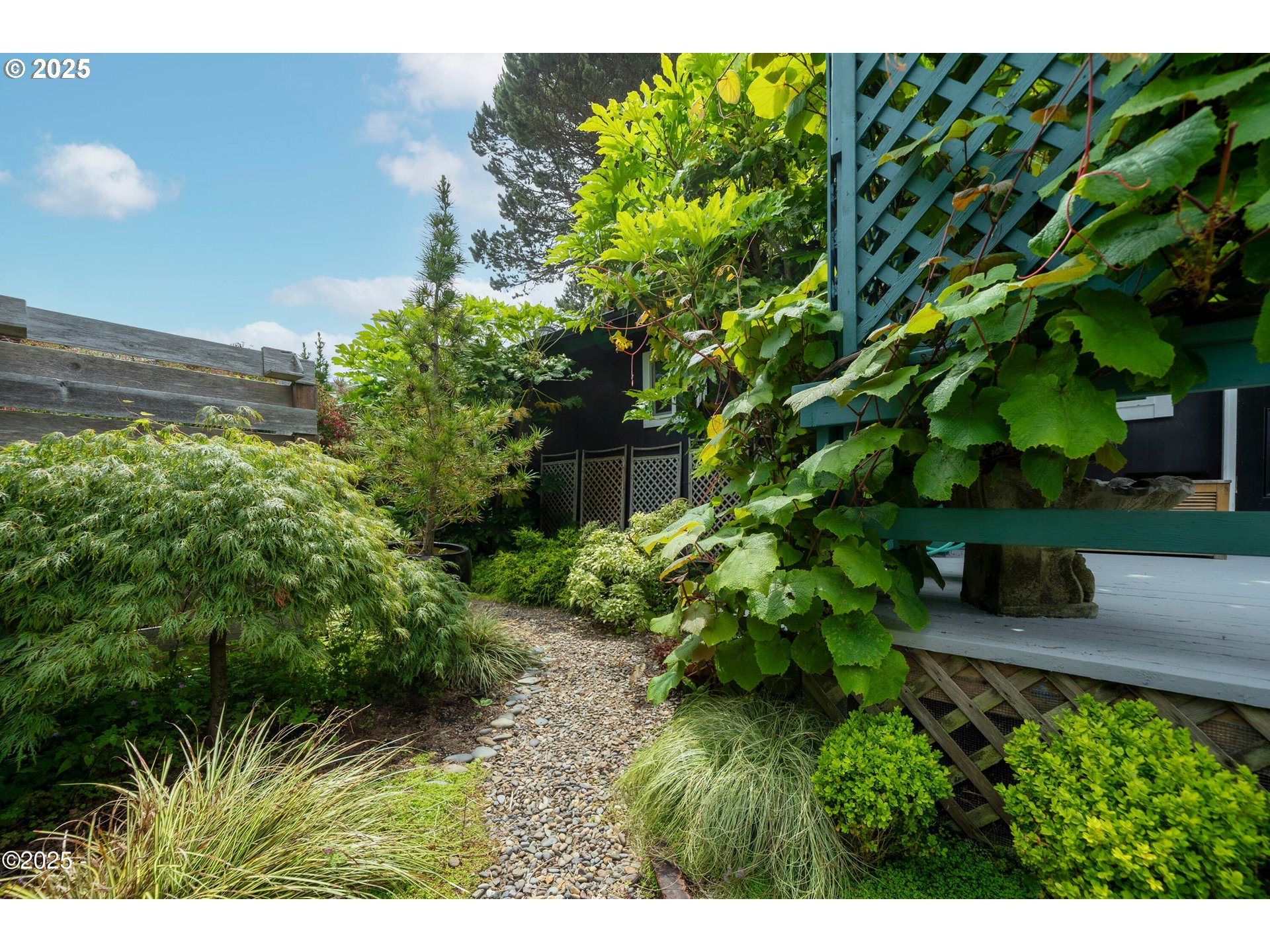 4875 Highway 101, Unit 11 Depoe Bay, OR 97341 - Photo 16 of 32 a plant is in a garden