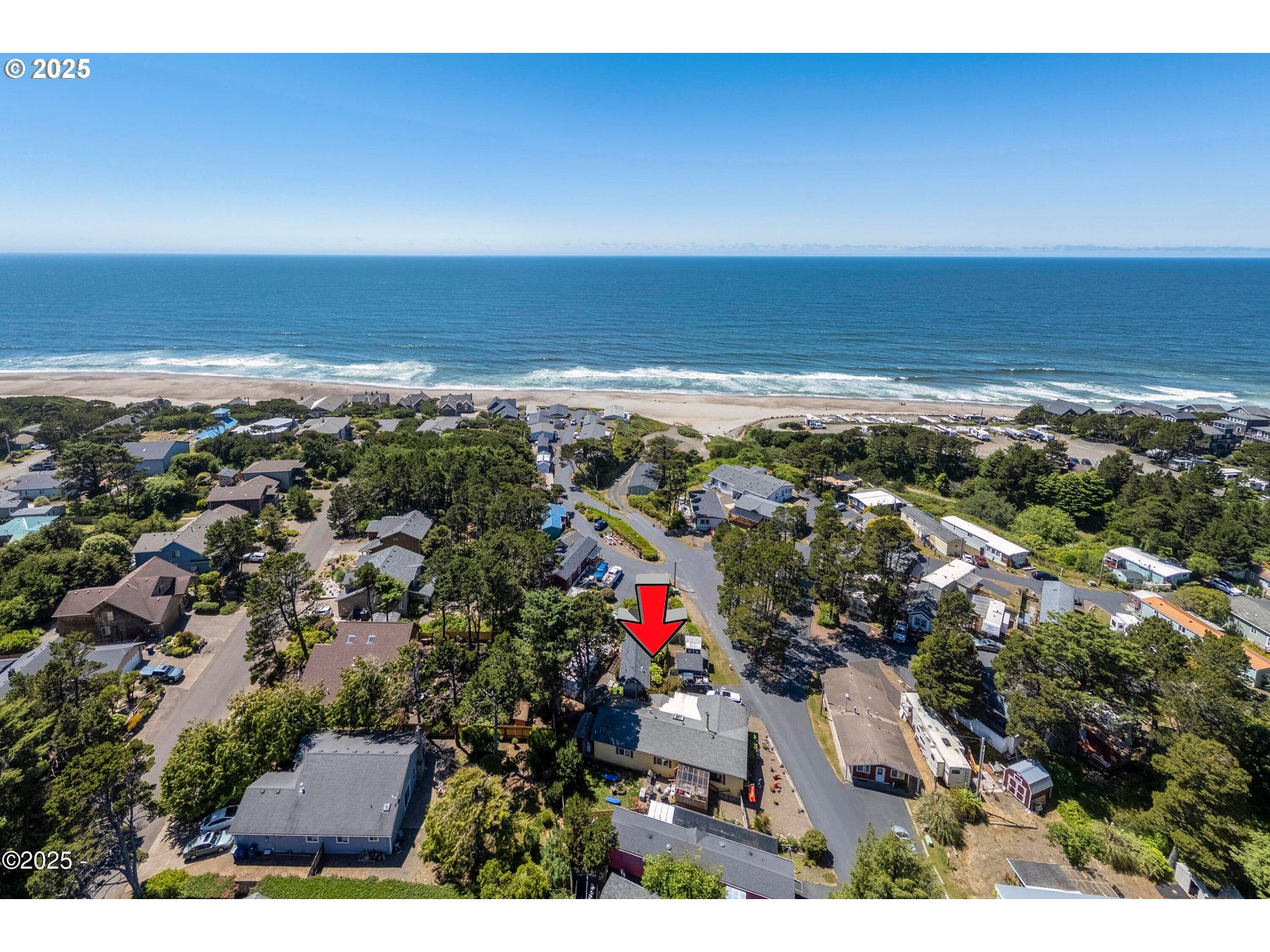 4875 Highway 101, Unit 11 Depoe Bay, OR 97341 - Photo 32 of 32 an aerial view of ocean and residential houses with outdoor space