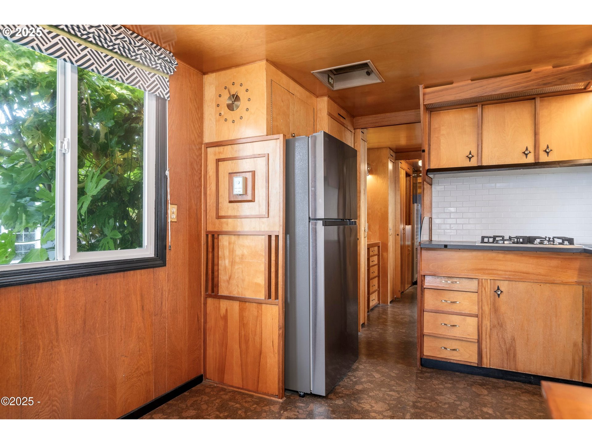 4875 Highway 101, Unit 11 Depoe Bay, OR 97341 - Photo 7 of 32 a kitchen with stainless steel appliances granite countertop a refrigerator and a stove