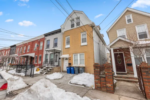 a front view of a building with retail shops