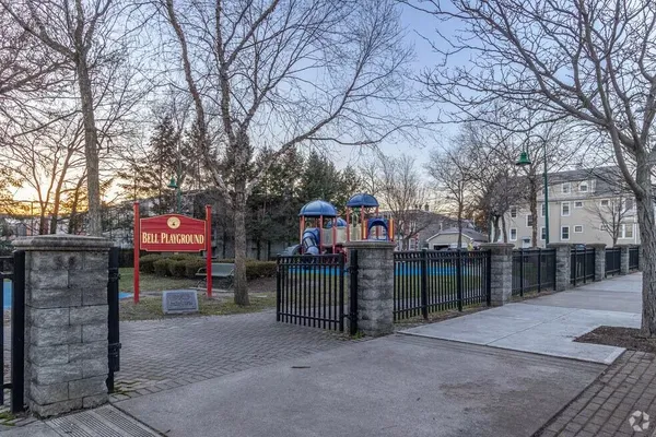 a view of street with wooden fence