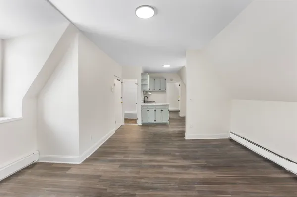 a view of kitchen with wooden floor