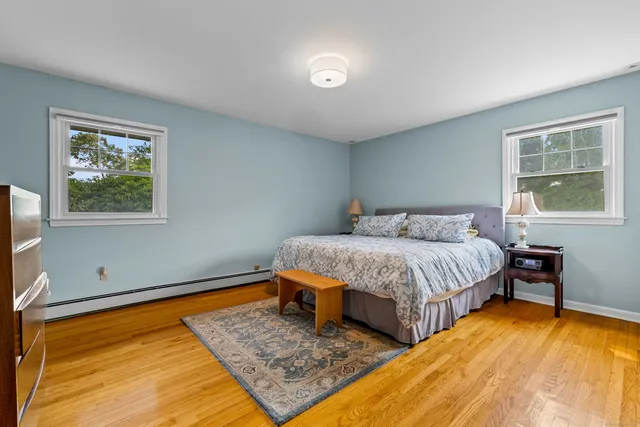 a bedroom with double bed and a window