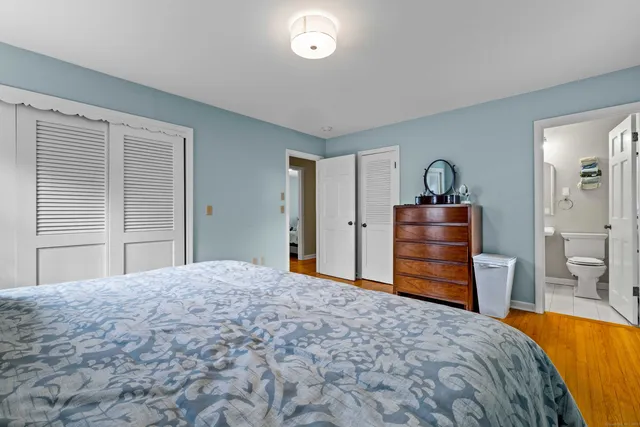 a bedroom with a bed and closet