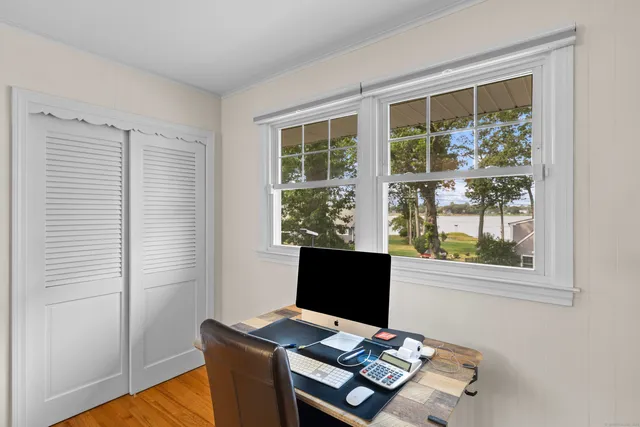 a workspace with furniture and window