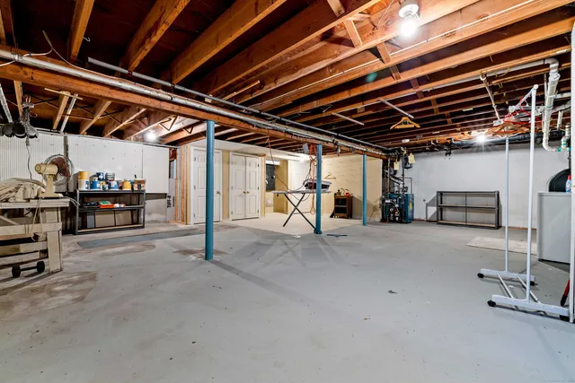 a view of empty room with wooden ceiling