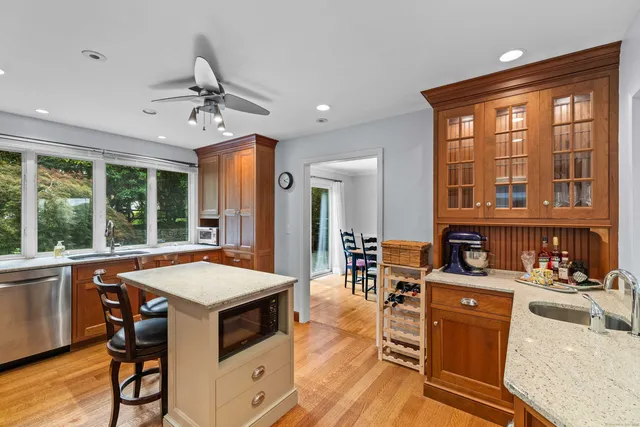 a open kitchen with stainless steel appliances granite countertop a stove and refrigerator