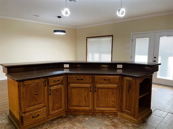 a kitchen with stainless steel appliances granite countertop a refrigerator and a stove