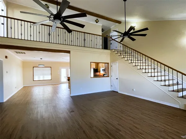 a view of a living room with wooden floor