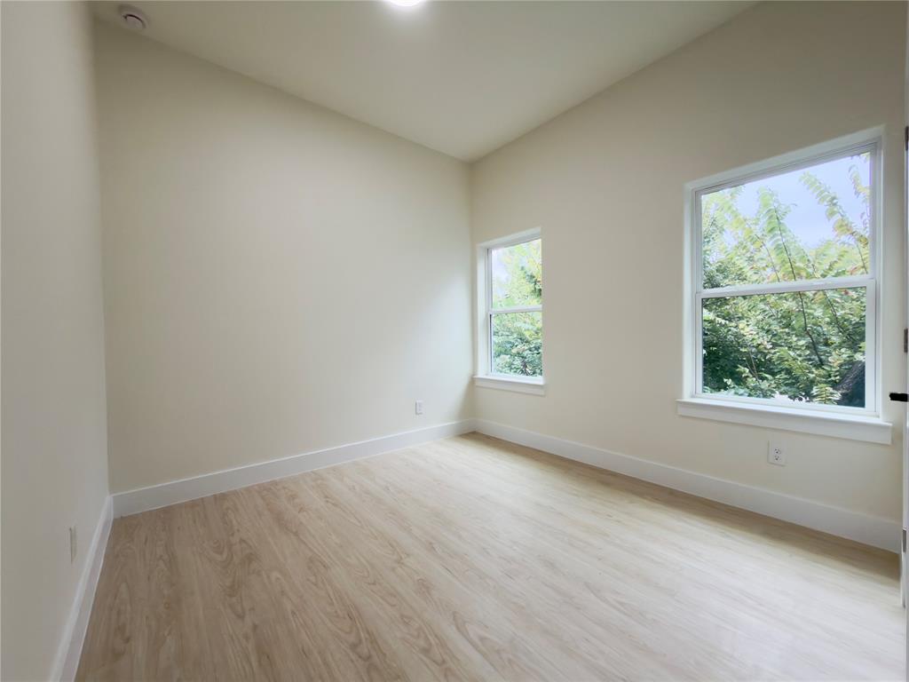 3119 Parvia Avenue Dallas, TX 75212 - Photo 29 of 36 Spare room with light wood-style floors and baseboards