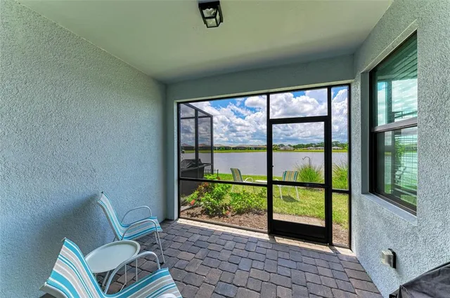 a kitchen with stainless steel appliances a microwave sink refrigerator and cabinets