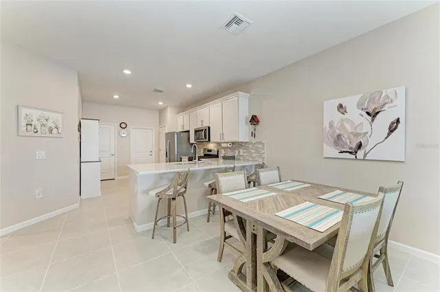 a kitchen with a stove top oven and sink