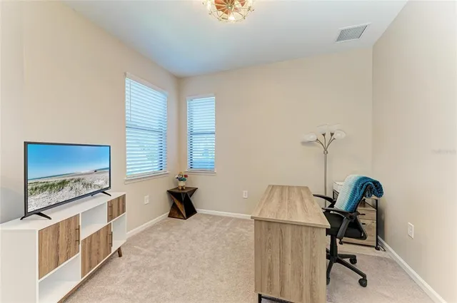 a view of a dining room with furniture window and outside view
