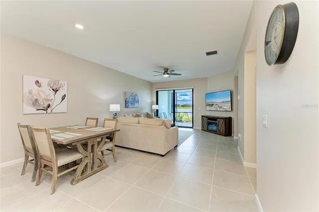 a view of a room that has a bed and a window