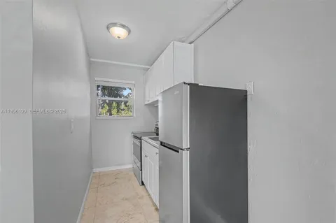 a kitchen that has a sink and a stove