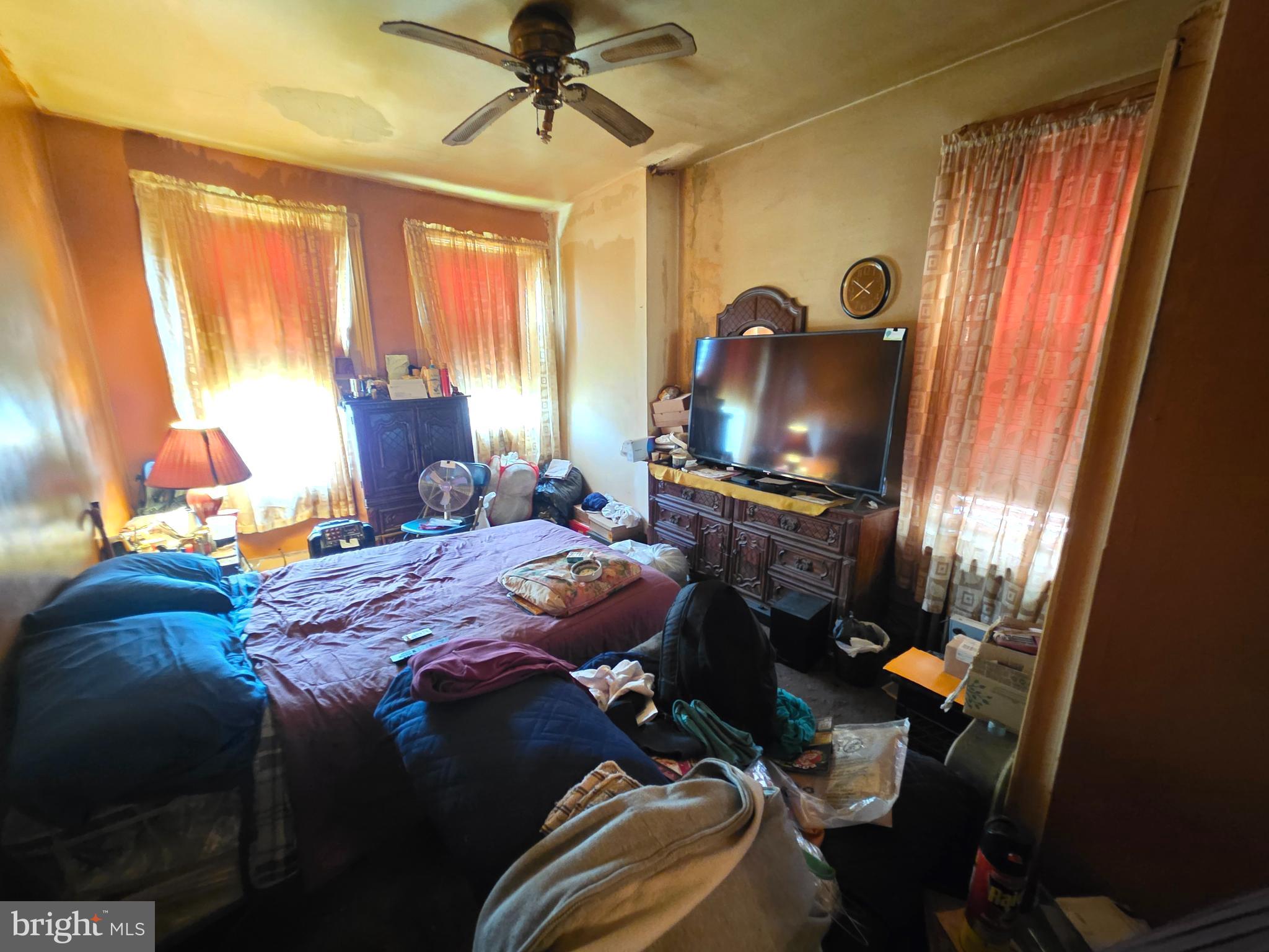 1317 East Rittenhouse Street Philadelphia, PA 19138 - Photo 9 of 16 a bed sitting in a bedroom next to a window