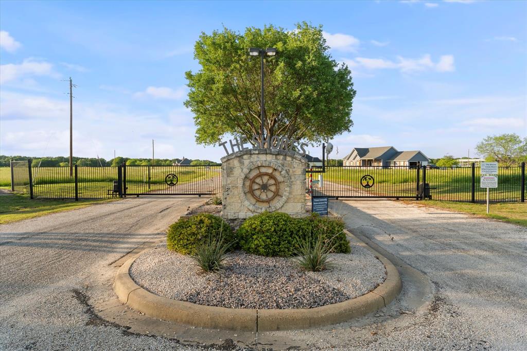 Lot 287 Southeast Pvt Road Corsicana, TX 75109 - Photo 12 of 22 Community / neighborhood sign with a gate