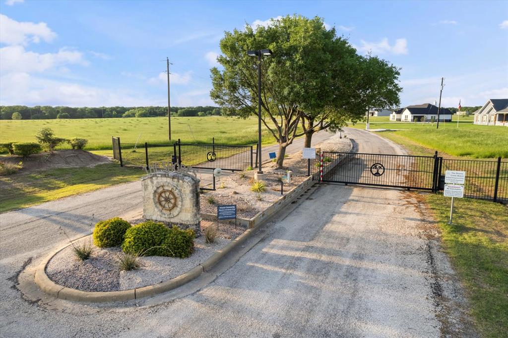 Lot 287 Southeast Pvt Road Corsicana, TX 75109 - Photo 22 of 22 View of street featuring a gate and curbs