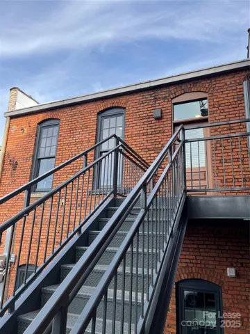 a view of a building with a street