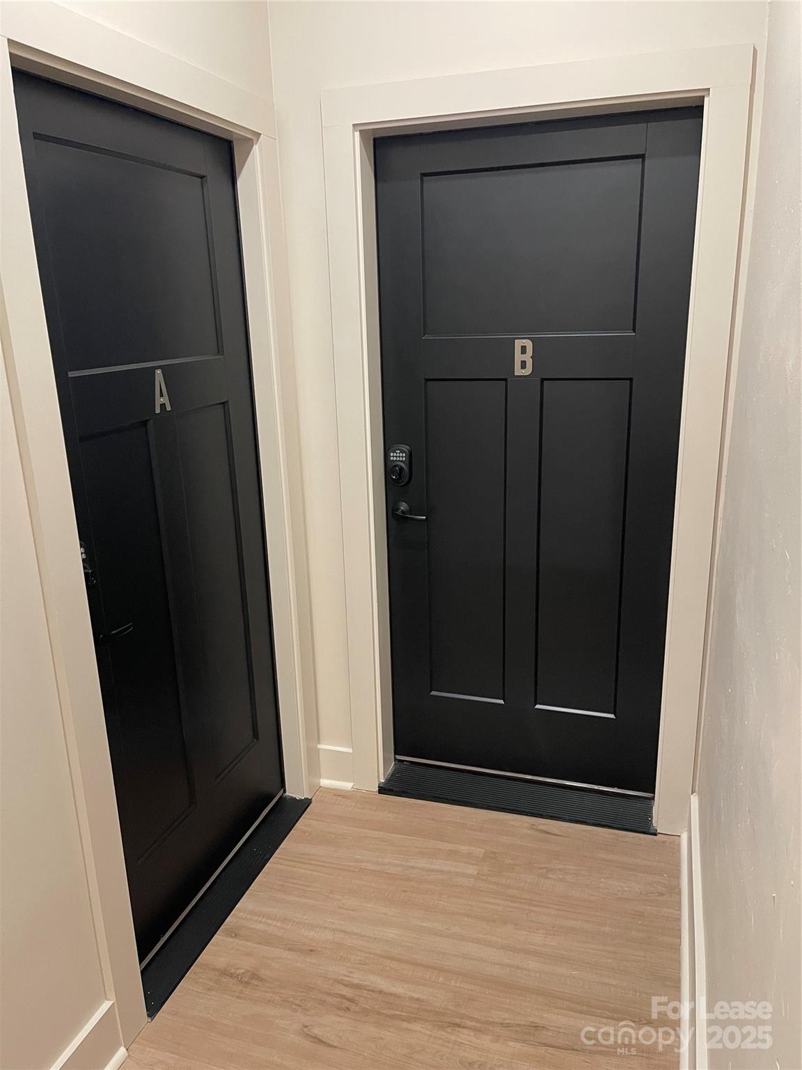 233 West Main Street, Unit B Albemarle, NC 28001 - Photo 2 of 12 an empty room with wooden floor