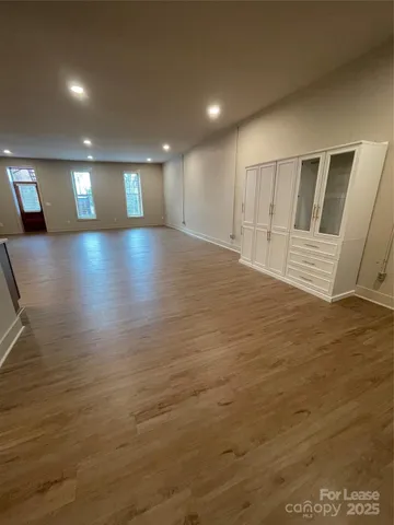 a view of hallway with wooden floor