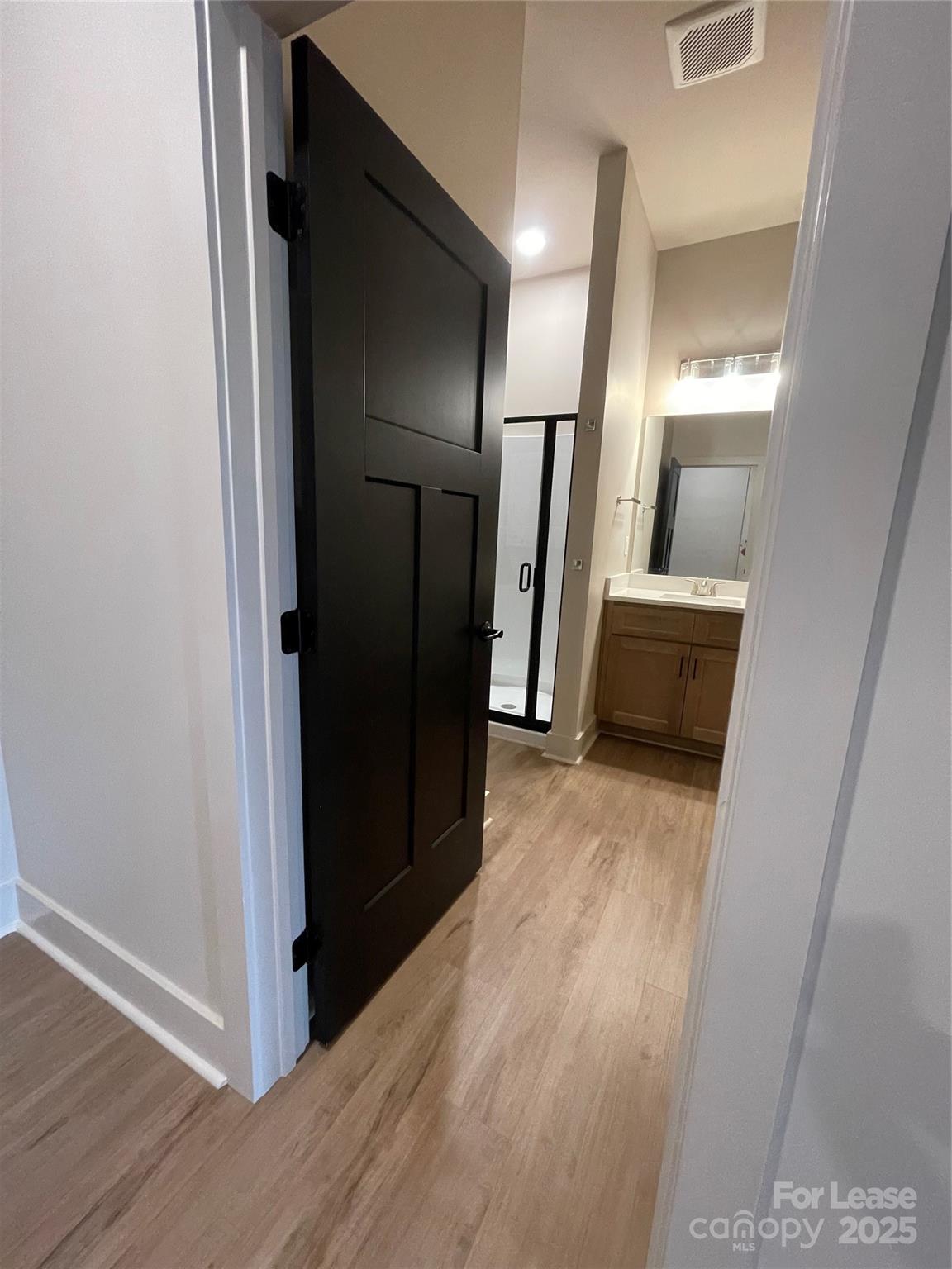 233 West Main Street, Unit B Albemarle, NC 28001 - Photo 7 of 12 a view of hallway with wooden floor