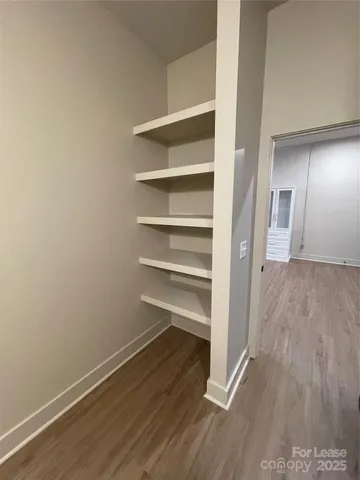 an entryway with wooden floor