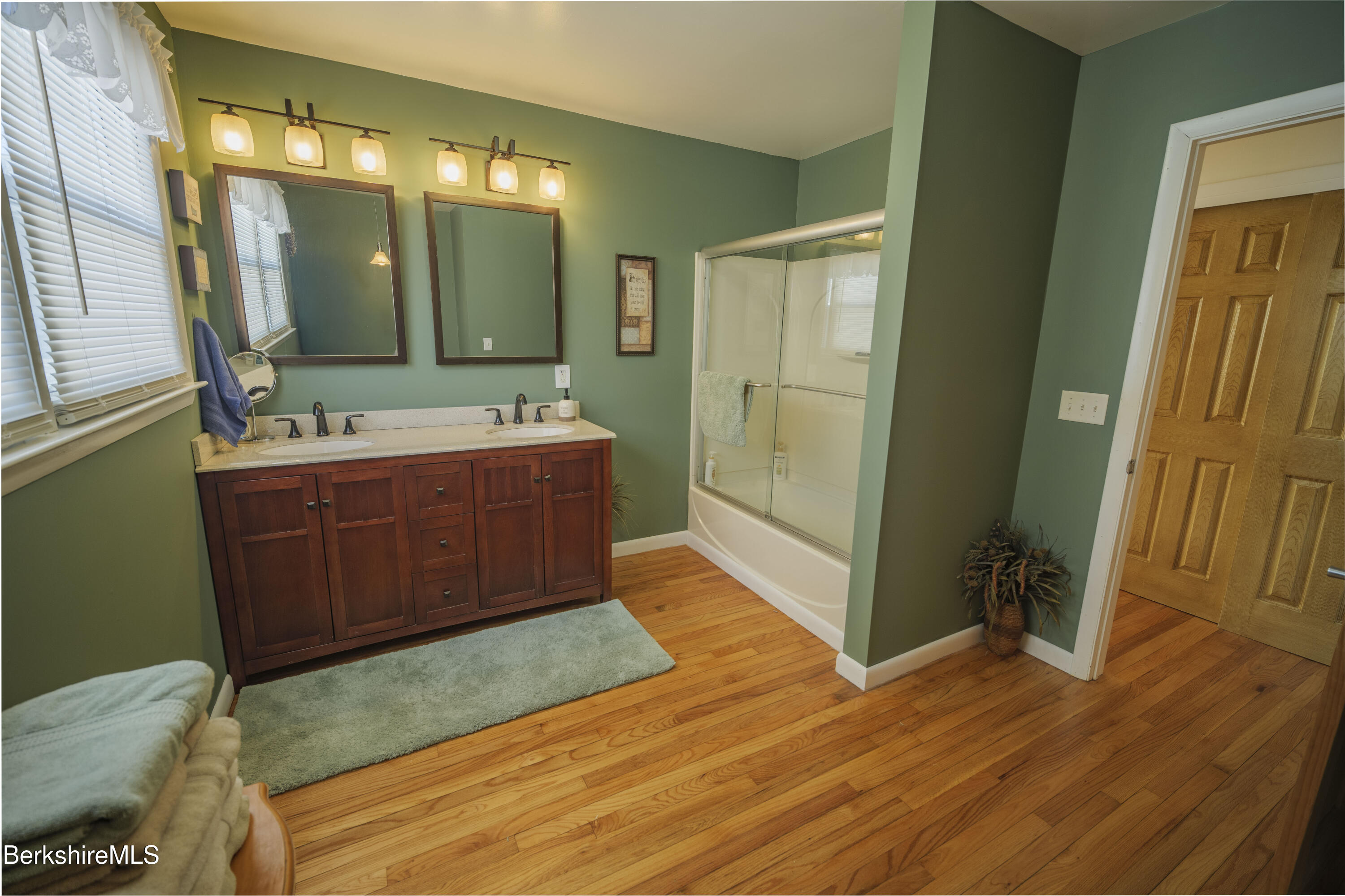 582 East New Lenox Road Pittsfield, MA 01201 - Photo 9 of 23 a spacious bathroom with a mirror sink and toilet