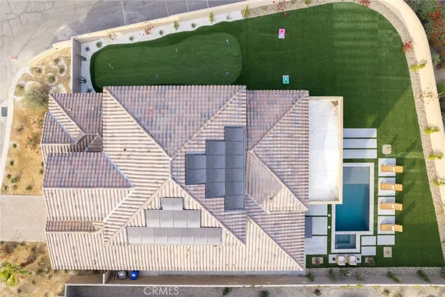 a large kitchen with stainless steel appliances a stove a sink dishwasher and a flat tv screen