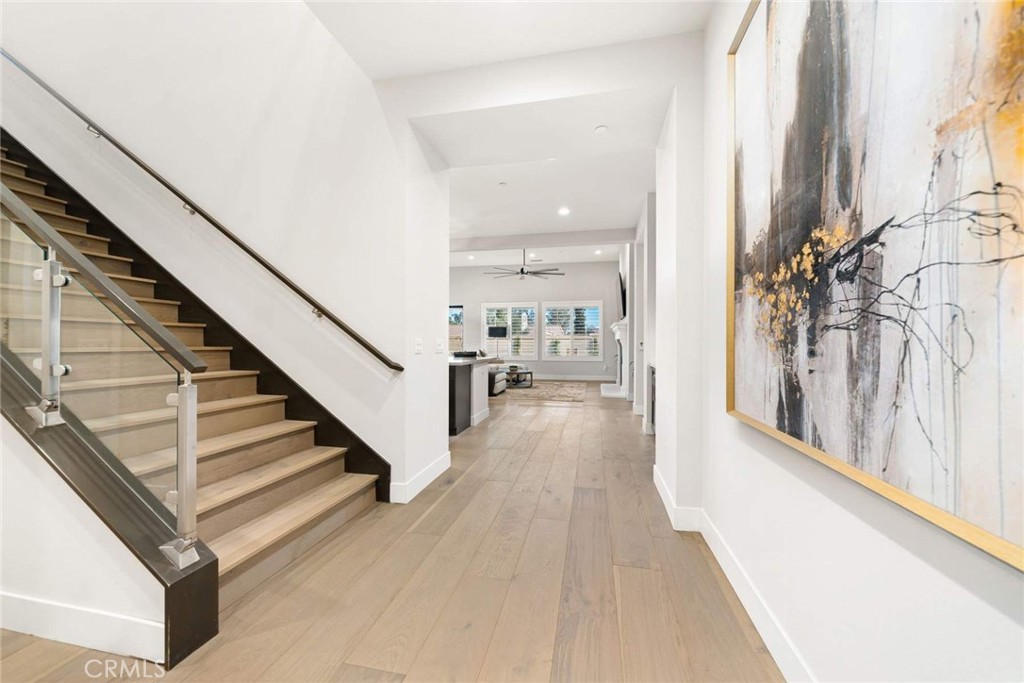 80495 Old Ranch Trail South La Quinta, CA 92253 - Photo 14 of 58 a view of a hallway with wooden floor and staircase