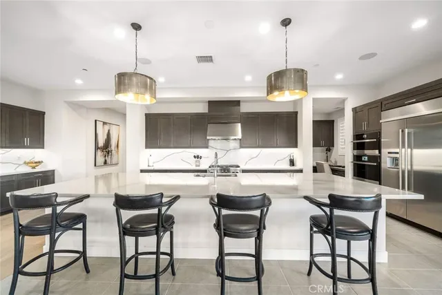 a dining room with furniture a window and a chandelier