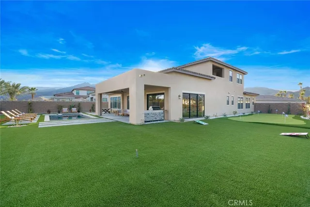 a bathroom with a tub sink double vanity and mirror