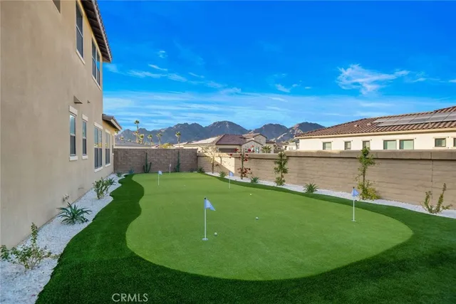 a spacious bedroom with a bed and a flat screen tv