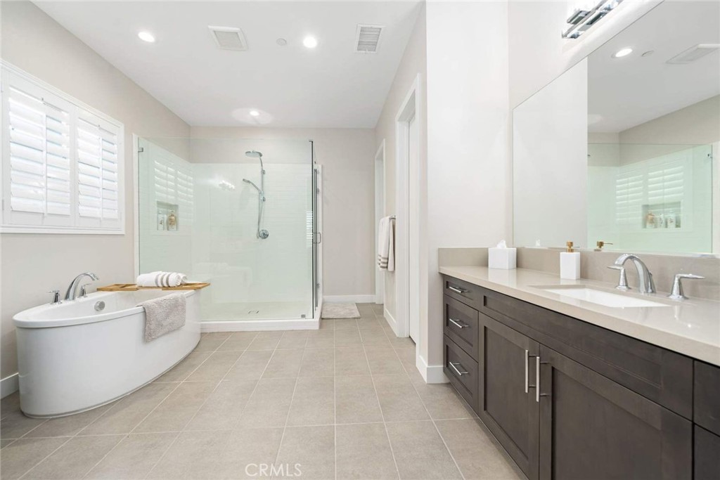 80495 Old Ranch Trail South La Quinta, CA 92253 - Photo 38 of 58 a bathroom with a tub sink double vanity and mirror