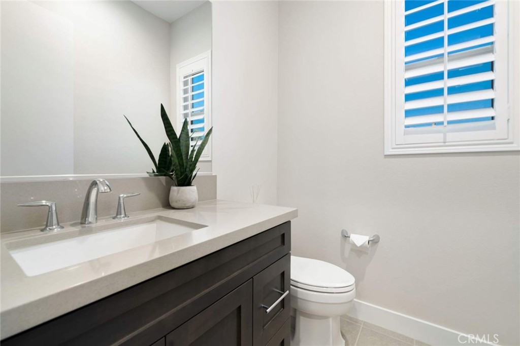 80495 Old Ranch Trail South La Quinta, CA 92253 - Photo 42 of 58 a bathroom with a sink a toilet and a mirror
