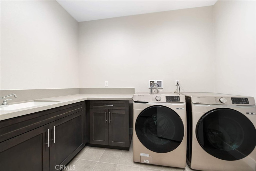 80495 Old Ranch Trail South La Quinta, CA 92253 - Photo 47 of 58 a utility room with dryer and washer