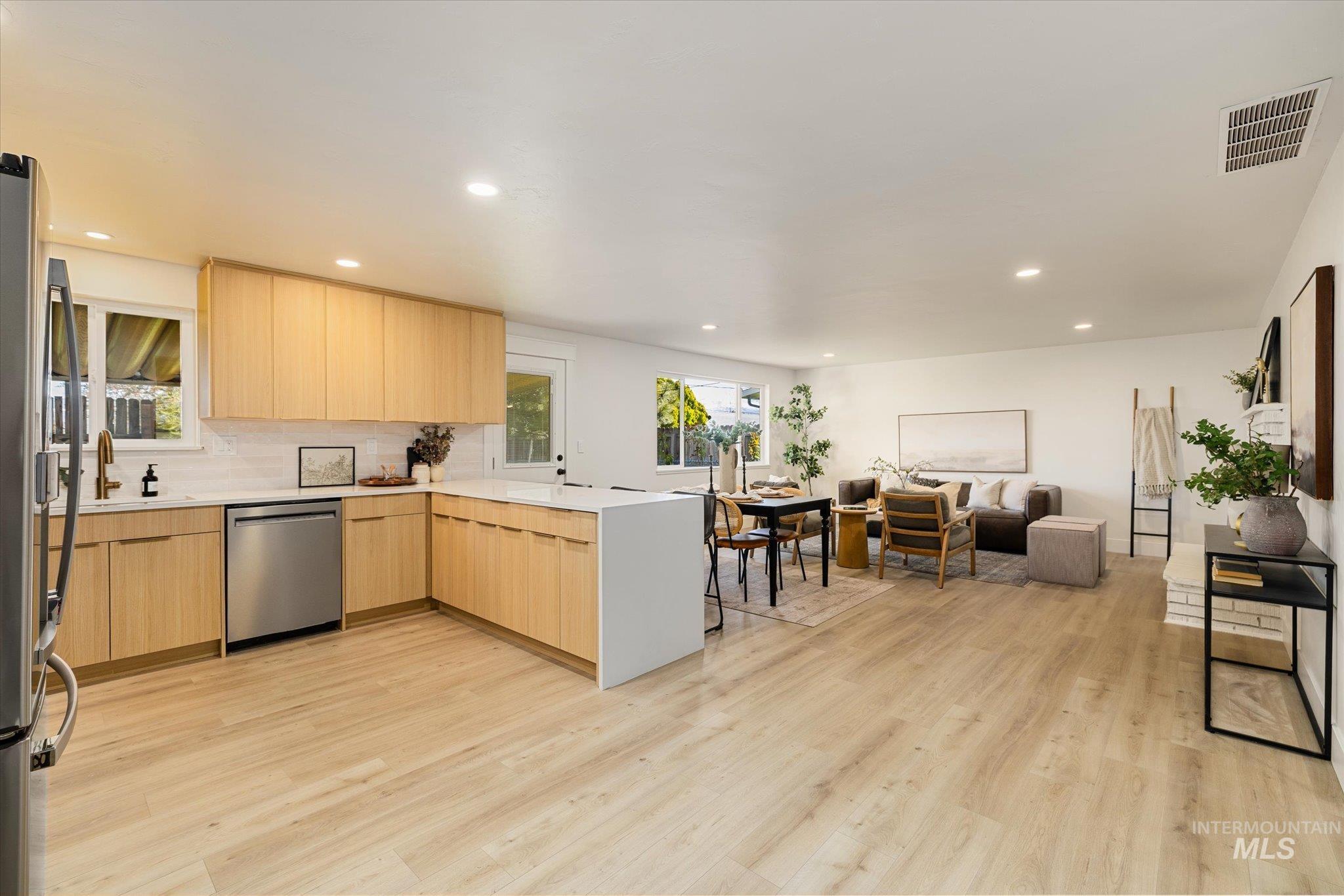 2220 Panama Street Boise, ID 83705 - Photo 27 of 27 Kitchen with light wood finish cabinetry, modern cabinets, open floor plan, a peninsula, and recessed lighting