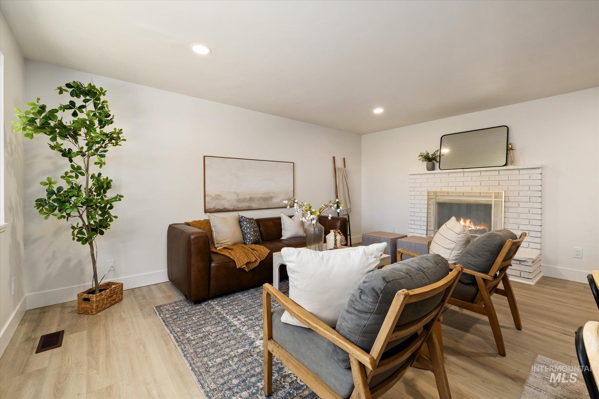 2220 Panama Street Boise, ID 83705 - Photo 5 of 27 Living room featuring a fireplace, light wood-type flooring, and recessed lighting