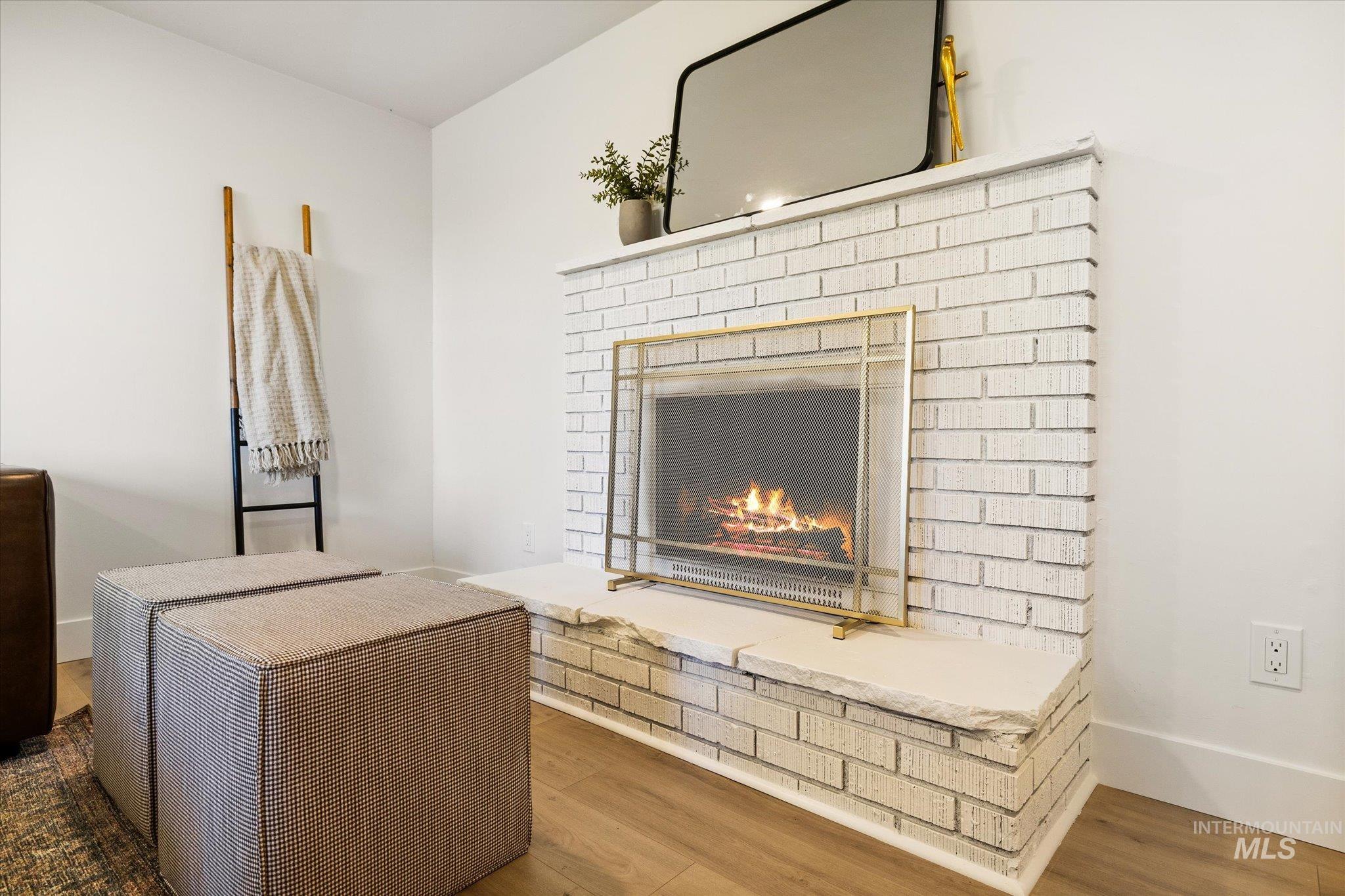 2220 Panama Street Boise, ID 83705 - Photo 6 of 27 Detailed view of wood finished floors and a brick fireplace