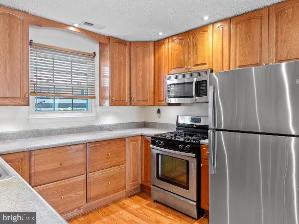 43 Via Cascata Drive Clementon, NJ 08021 - Photo 11 of 26 a kitchen with granite countertop a refrigerator stove and microwave