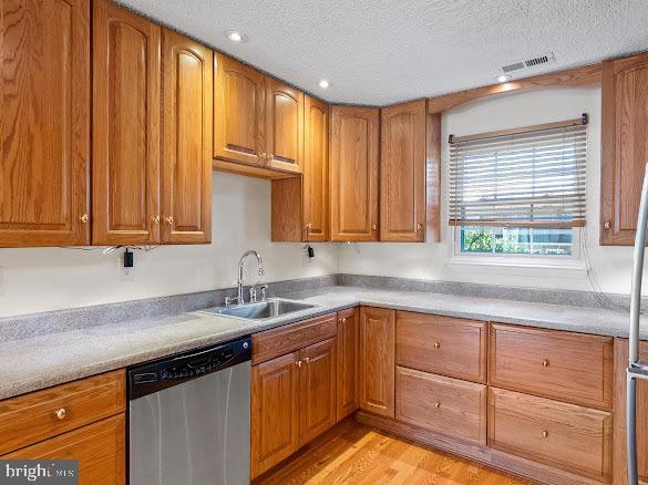 43 Via Cascata Drive Clementon, NJ 08021 - Photo 12 of 26 a kitchen with granite countertop wooden cabinets a sink and dishwasher