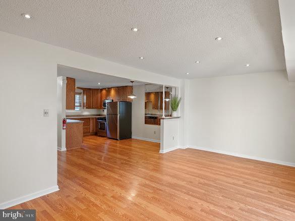 43 Via Cascata Drive Clementon, NJ 08021 - Photo 7 of 26 a view of a kitchen with refrigerator and an empty room
