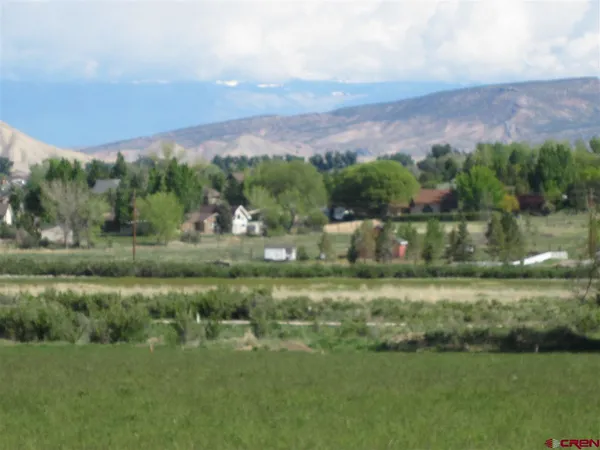 a view of a lake with a yard