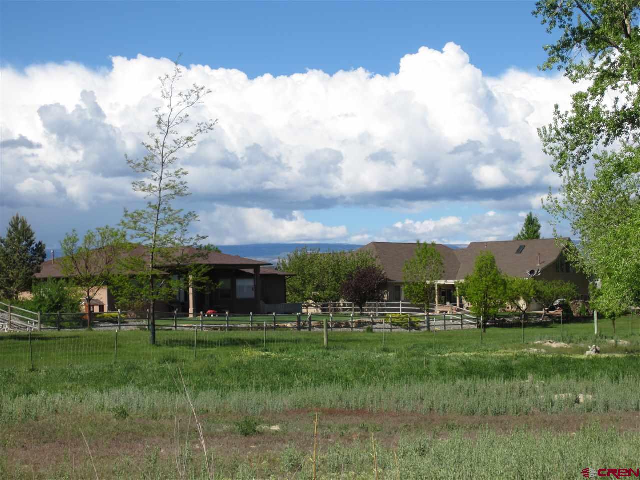 16666 6725 Road Montrose, CO 81401 - Photo 12 of 24 a view of an apartment with a table and chairs
