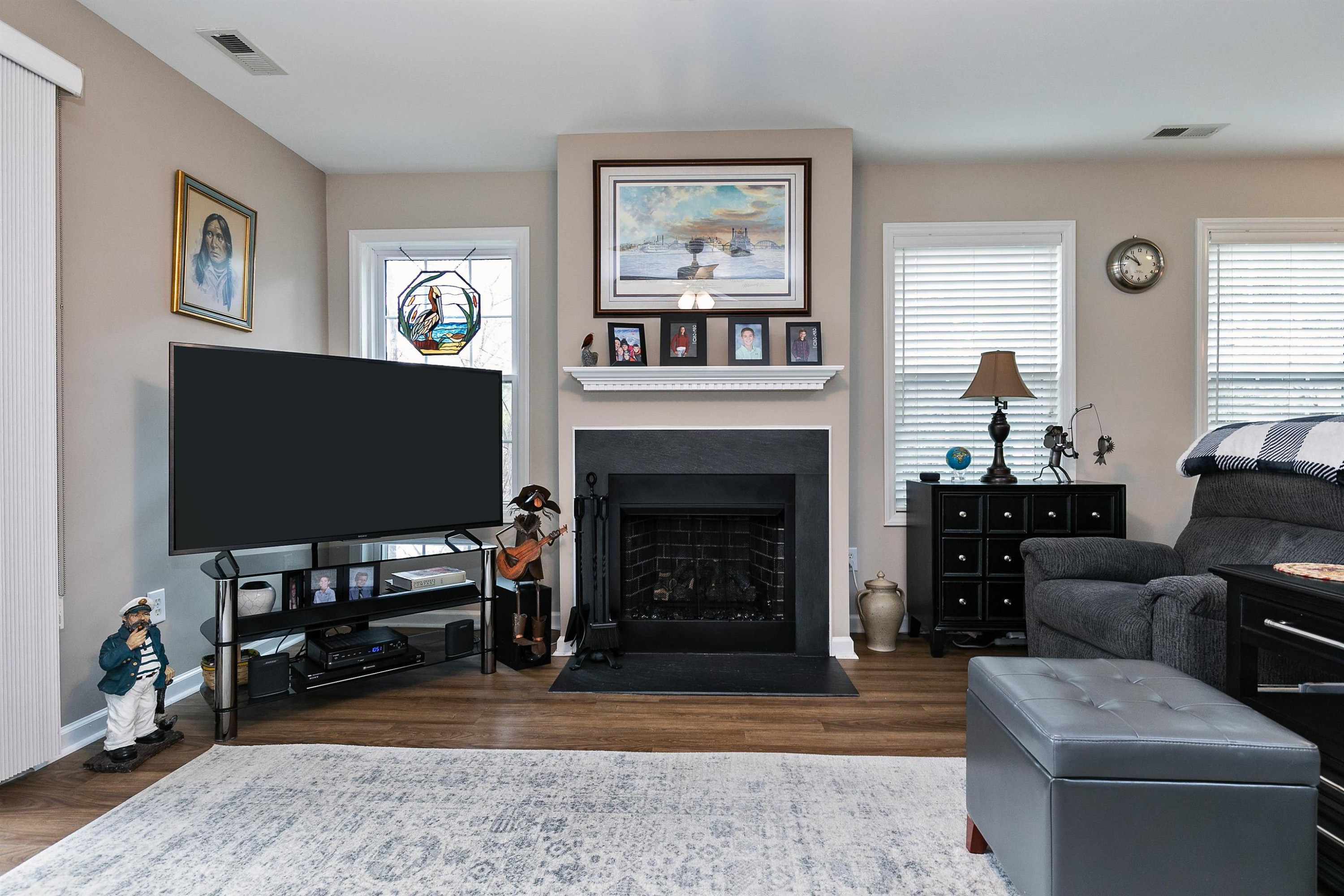 2213 Wellington Ridge Loop Cary, NC 27518 - Photo 4 of 29 lots of windows with slate fireplace ..... Family Room