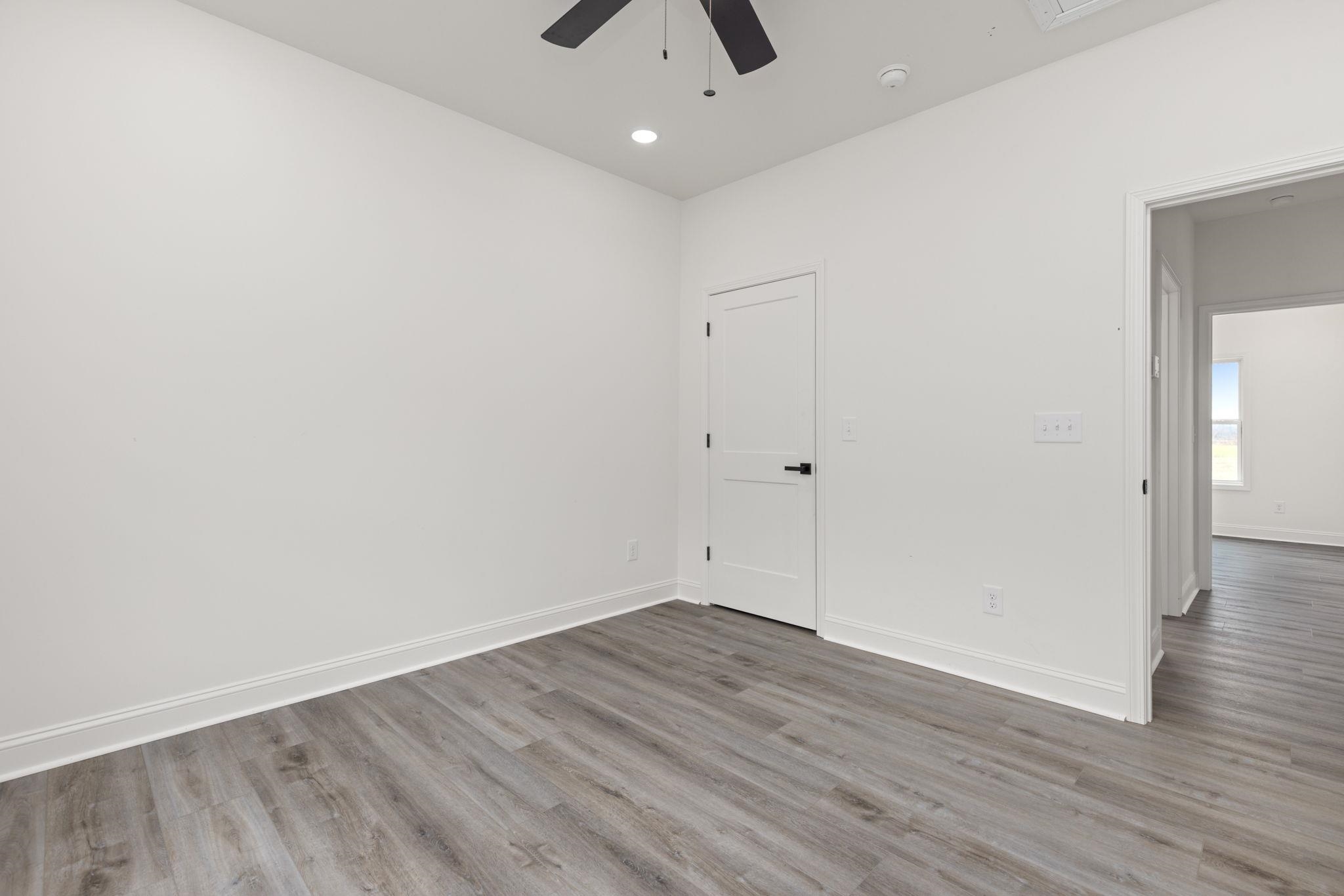 460 County Road 514 Rienzi, MS 38865 - Photo 16 of 29 wooden floor in an empty room