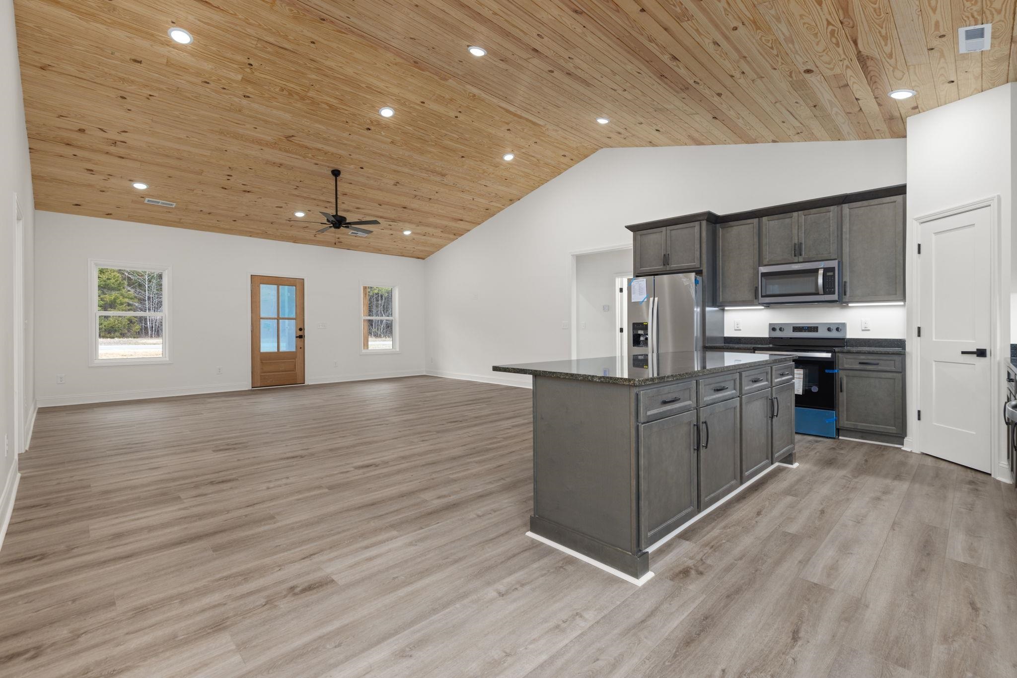 460 County Road 514 Rienzi, MS 38865 - Photo 6 of 29 a kitchen with stainless steel appliances kitchen island granite countertop a stove and a sink