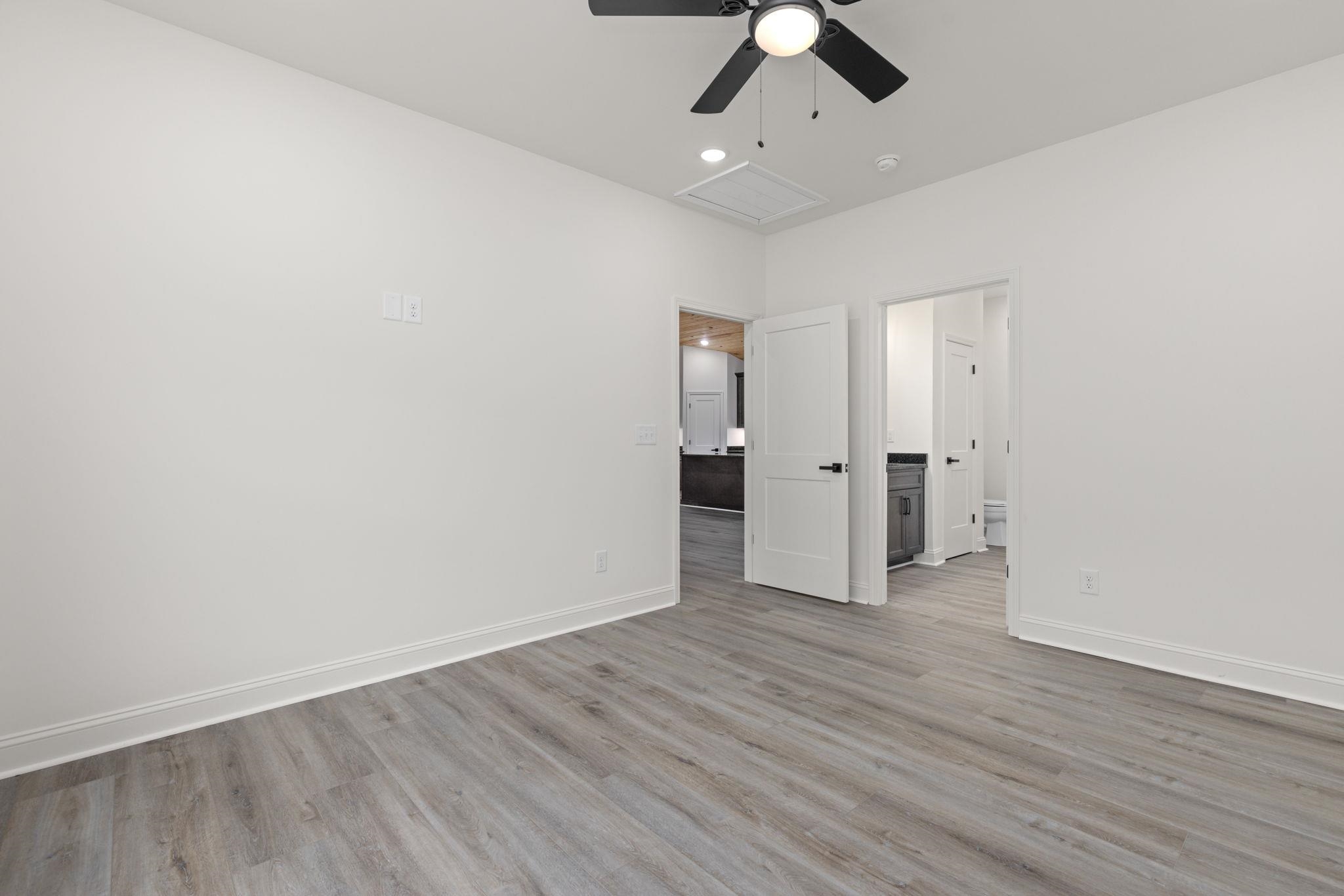 460 County Road 514 Rienzi, MS 38865 - Photo 10 of 29 a view of an empty room with wooden floor