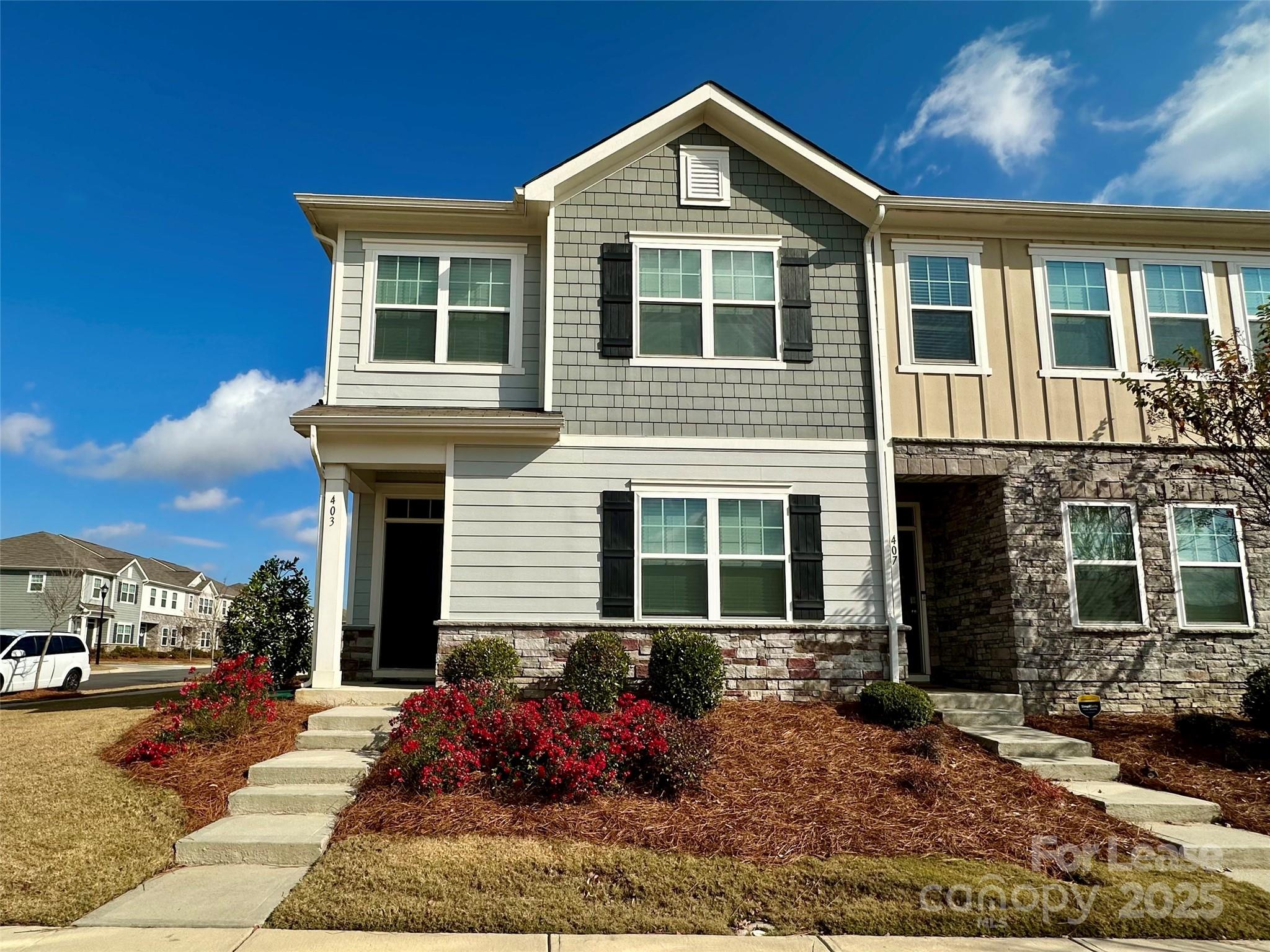 403 Wescott Street, Unit 68 Indian Trail, NC 28079 - Photo 1 of 42 a front view of a house with garden